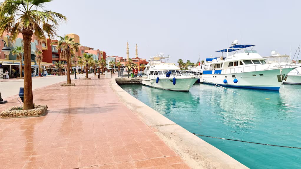 Hurghada Marina waterfront with luxury yachts, restaurants, and shops